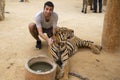 Man in Tiger temple in Thailand Royalty Free Stock Photo
