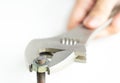 Close up adjustable spanner and bolt on isolate white background Royalty Free Stock Photo