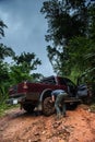 A man tighting the chain to the wheel for climbing the off road