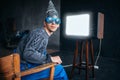 Man in tinfoil helmet and hypnotizing glasses, UFO