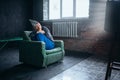 Man in tinfoil helmet watch TV, mind protection Royalty Free Stock Photo