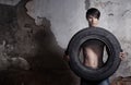 Man with tire Royalty Free Stock Photo