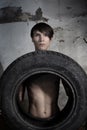 Man with tire Royalty Free Stock Photo