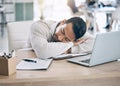 Man, tired and sleep at office desk with computer, notebook or exhausted at startup finance job. Worker, burnout and