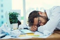 Man, tired and sleeping on office desk with burnout, fatigue and overworked business employee with glasses, documents