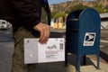 California election ballot deposited at mail box