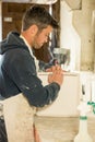 Man About to Split a Plaster Mold Royalty Free Stock Photo