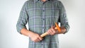 A man with a tool in his hands, a hammer on a white background Royalty Free Stock Photo
