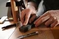 Man with tools for leather working Royalty Free Stock Photo