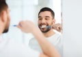 Man with toothbrush cleaning teeth at bathroom Royalty Free Stock Photo