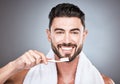 Man, toothbrush and portrait smile for dental care, hygiene or skincare against a gray studio background. Happy male Royalty Free Stock Photo