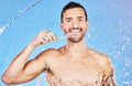 Man, toothbrush and smile for dental care, hygiene and cosmetics against an aqua blue studio background. Portrait of Royalty Free Stock Photo