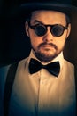 Man with Top Hat and Steampunk Glasses Retro Portrait