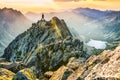 Man on the top of the hill watching wonderful scenery in mountains during summer colorful sunset in High Tatras in Slovakia Royalty Free Stock Photo