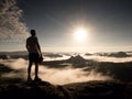 Man at the top of a mountain looking the misty landscape. Feel free Royalty Free Stock Photo