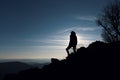 Man at the top of a mountain