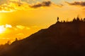 Man on top of a mountain sunset harmony adventure