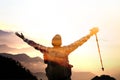 Man on the top of mountain watching sunrise