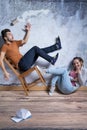 Man on toppling chair Royalty Free Stock Photo