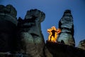 Man torch on the rocks Royalty Free Stock Photo