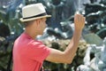 Man tosses coin into fountain Royalty Free Stock Photo