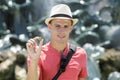 man tosses coin into fountain Royalty Free Stock Photo