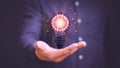 Man touching a bright light bulb icon. Ideas for presenting new ideas, inspiration in the work and innovation new beginning Royalty Free Stock Photo