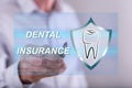 Man touching a dental insurance concept on a touch screen
