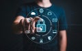 Man touching digital padlock securing data with security icons around it Royalty Free Stock Photo