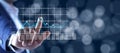 Man touching in graph in screen on bokeh background Royalty Free Stock Photo