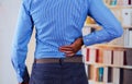 Man touching his back with one of his hand, back pain Royalty Free Stock Photo