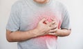 A man touching his heart, with red highlight of heart attack, heart failure, others heart disease and broken heart Royalty Free Stock Photo