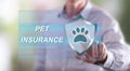 Man touching a pet insurance concept on a touch screen