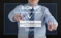 Man touching a signup concept on a touch screen