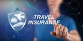 Man touching a travel insurance concept Royalty Free Stock Photo