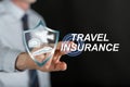 Man touching a travel insurance concept on a touch screen Royalty Free Stock Photo