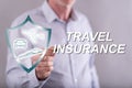 Man touching a travel insurance concept on a touch screen Royalty Free Stock Photo