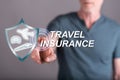 Man touching a travel insurance concept on a touch screen Royalty Free Stock Photo