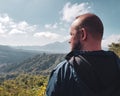 Man tourist admire beautiful mountain view in Bali Royalty Free Stock Photo