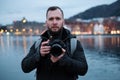 Tourist with camrea against Tyskebryggen in Bergen, Norway