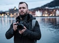 Tourist with camrea against Tyskebryggen in Bergen, Norway