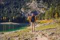 Man tourist in background of Panoramic morning view of Black Lake Crno Jezero. Calm summer scene of Durmitor Nacionalni Royalty Free Stock Photo