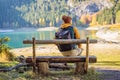 Man tourist in background of Panoramic morning view of Black Lake Crno Jezero. Calm summer scene of Durmitor Nacionalni Royalty Free Stock Photo