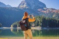 Man tourist in background of Panoramic morning view of Black Lake Crno Jezero. Calm summer scene of Durmitor Nacionalni Royalty Free Stock Photo