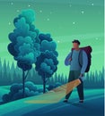 Man tourist with backpack and hiking stick walks with flashlight in dark forest. Outdoor travelling