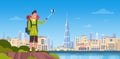 Man Tourist With Backpack Taking Selfie Photo Over Beautiful Dubai City Background