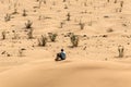 Man tourist in desert rub al khali Oman sitting sand view landscape 2