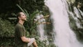 Man tourist enjoying Landscape of wachirathan waterfall, Inthanon National Park, Thailand Royalty Free Stock Photo