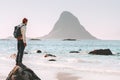 Man tourist enjoying sea and rock view on beach Royalty Free Stock Photo