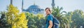 Man tourist enjoying the view Blue Mosque, Sultanahmet Camii, Istanbul, Turkey BANNER, LONG FORMAT Royalty Free Stock Photo